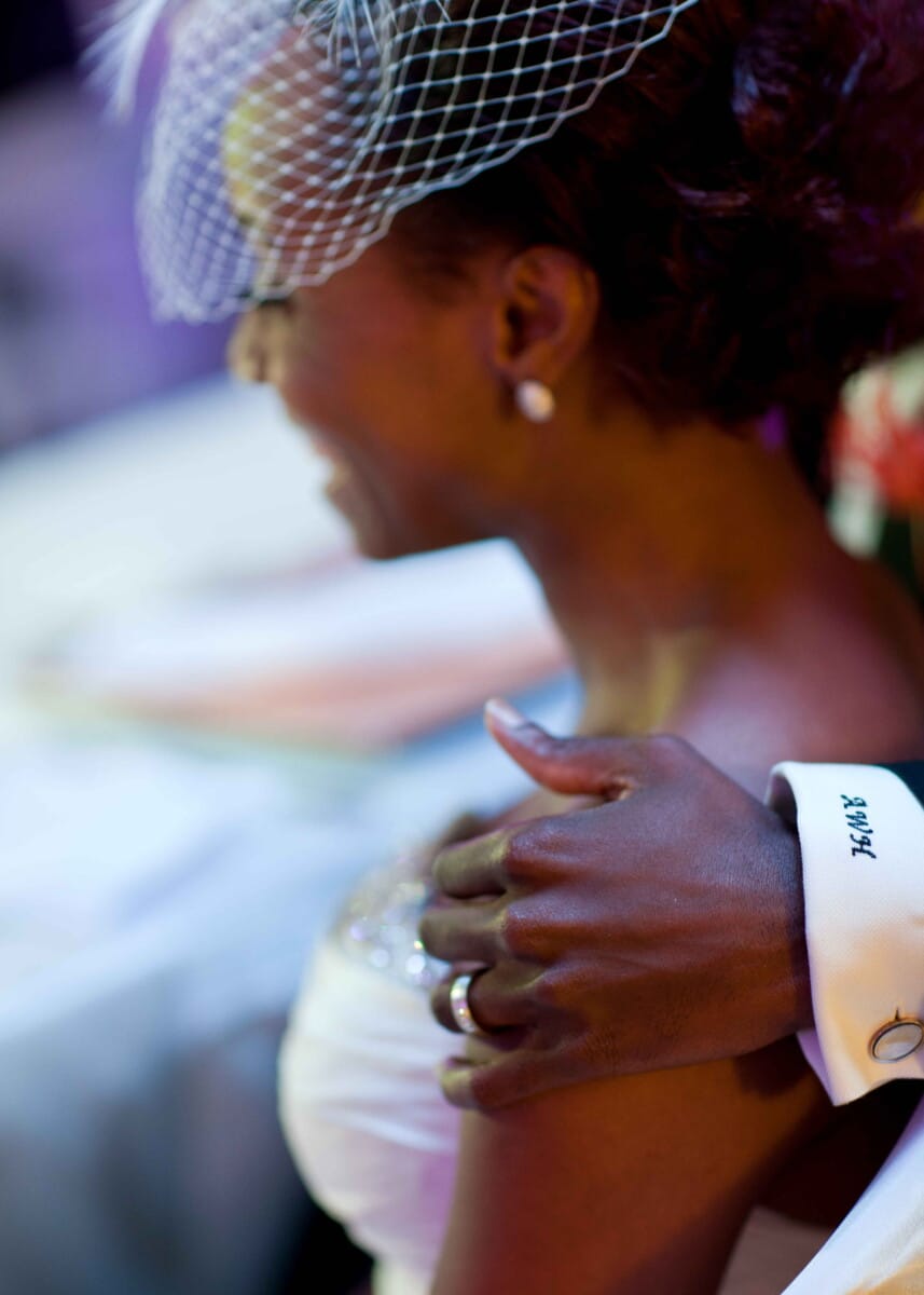 Groom embracing the bride during an intimate wedding portrait