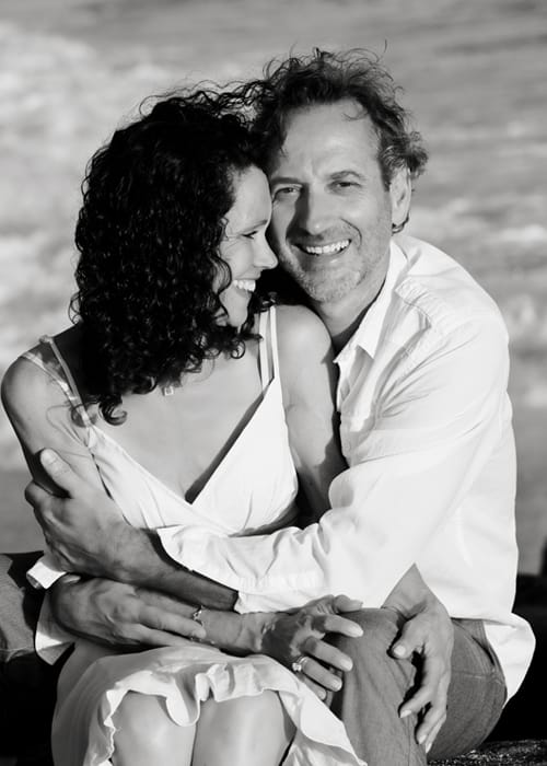 Couple embracing in a black-and-white Barbados portrait