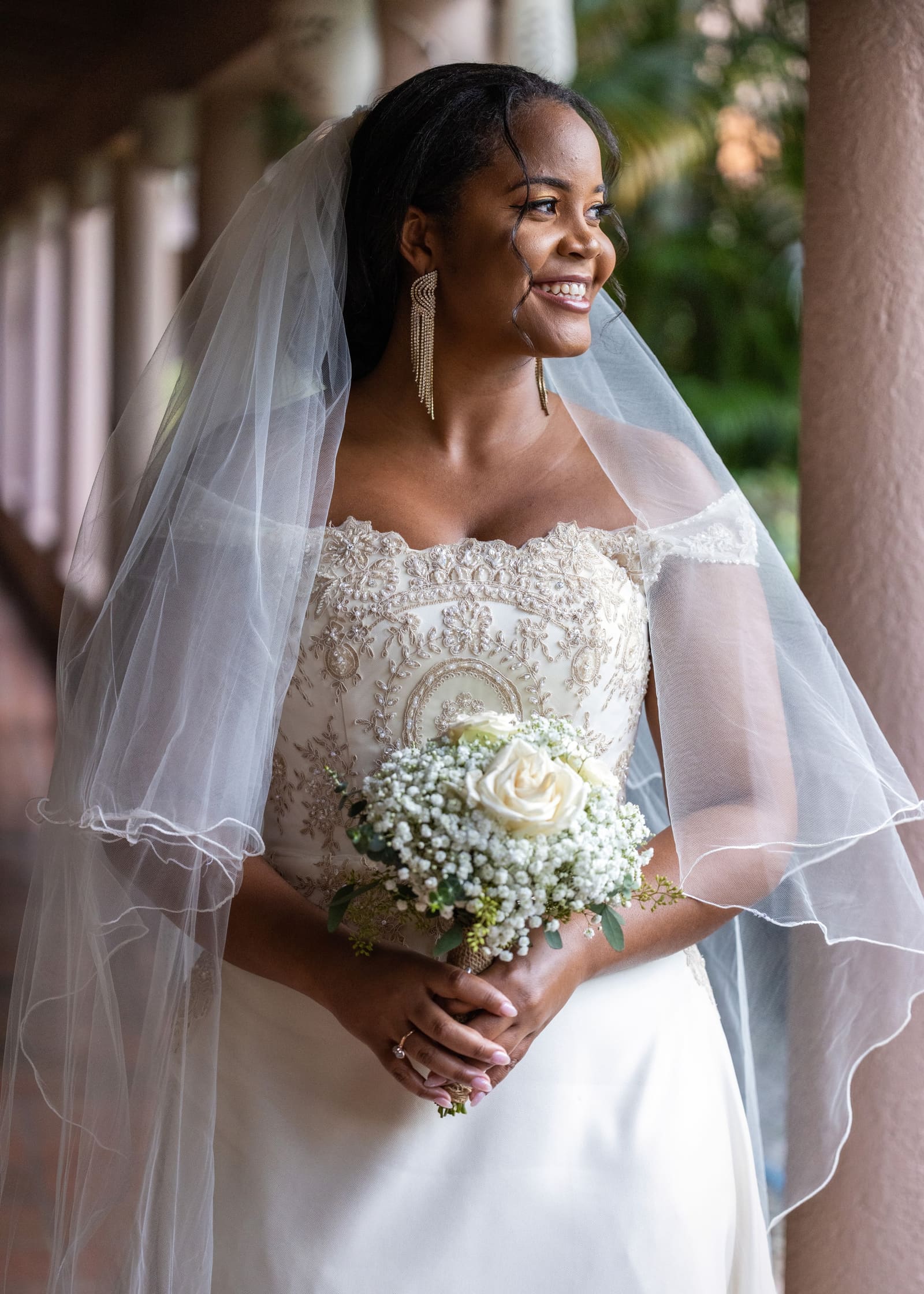 Bride in a lace veil holding a white bouquet, Barbados
