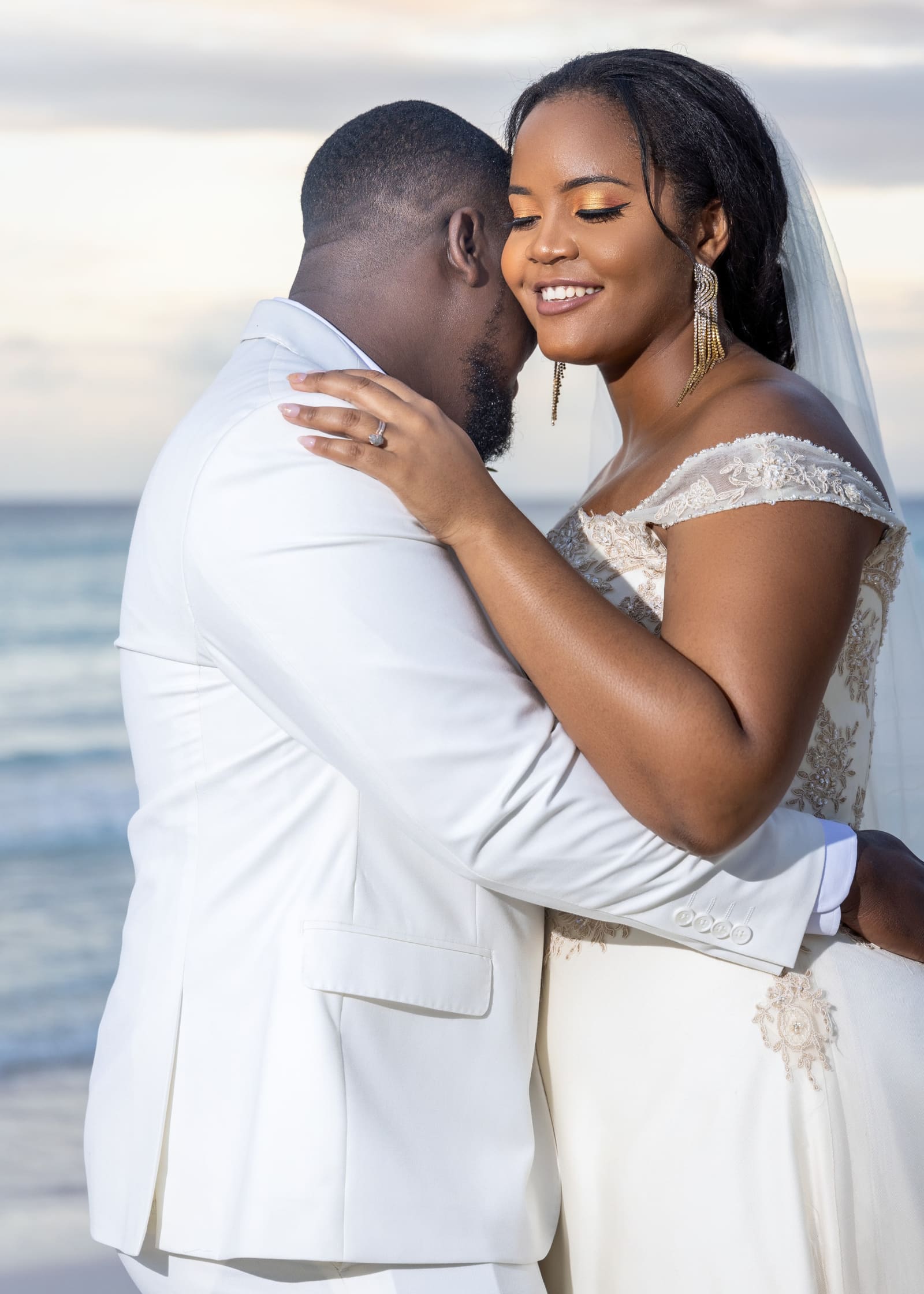 Bride and groom embracing in the evening light, Barbados