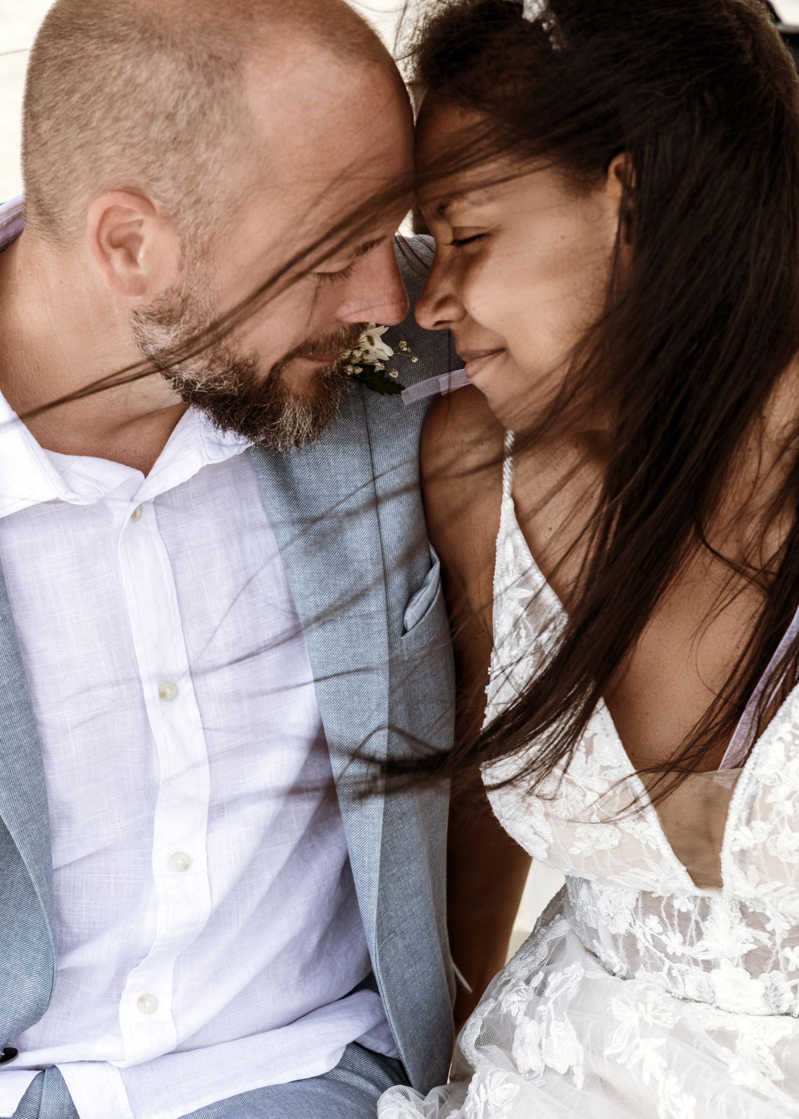 Couple touching foreheads in a close embrace, Barbados