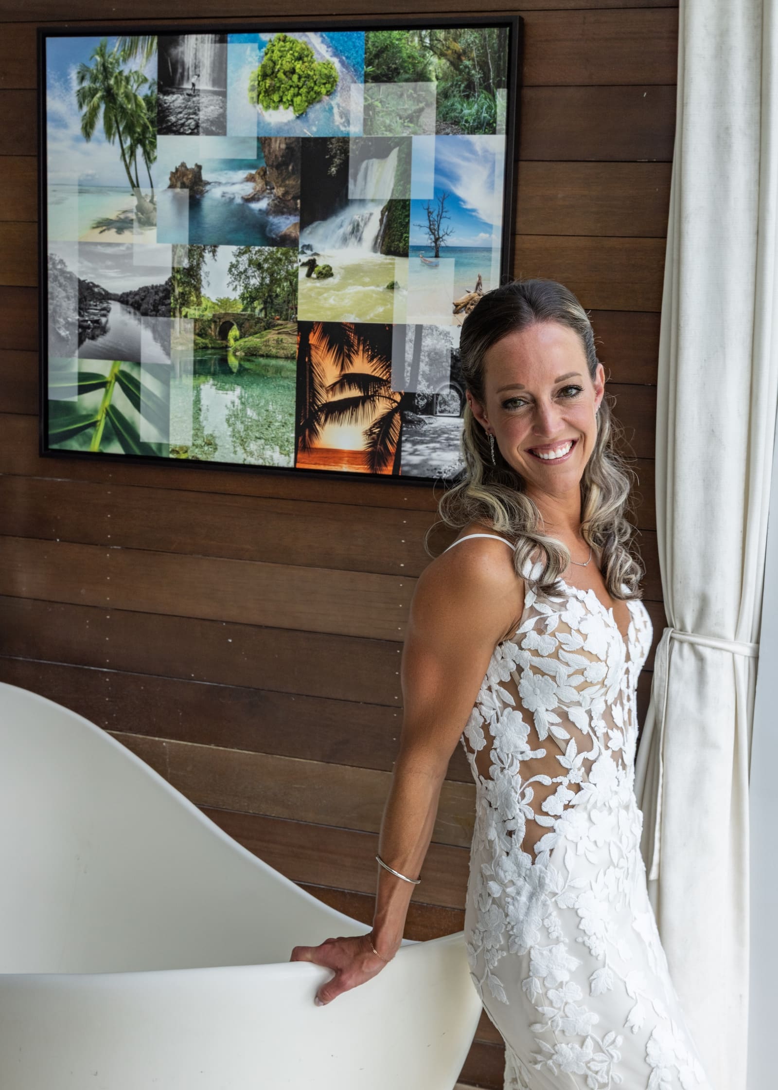 Bride smiling beside a window before the ceremony, Barbados