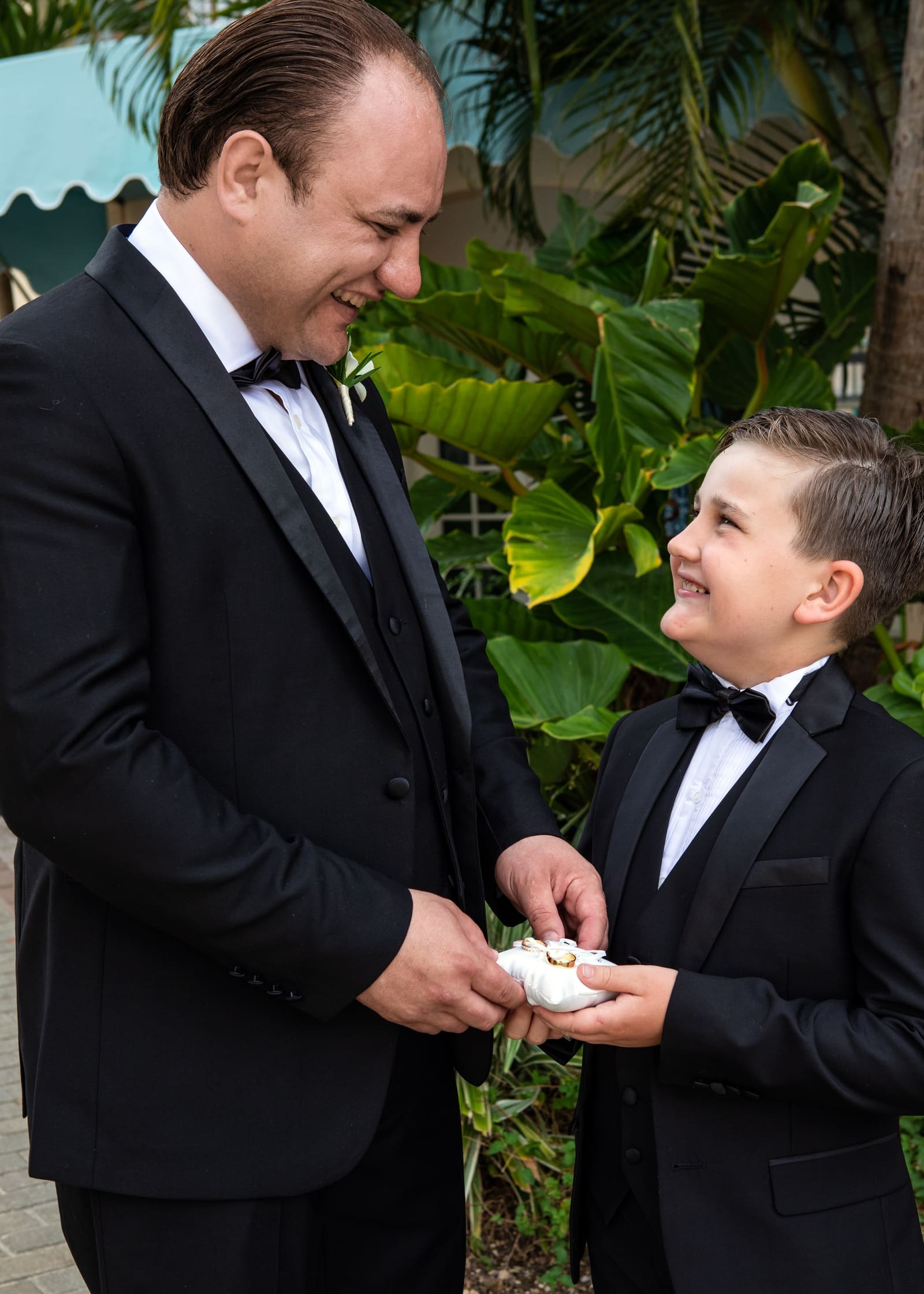 Groom and page boy in tuxedos with the rings, Barbados