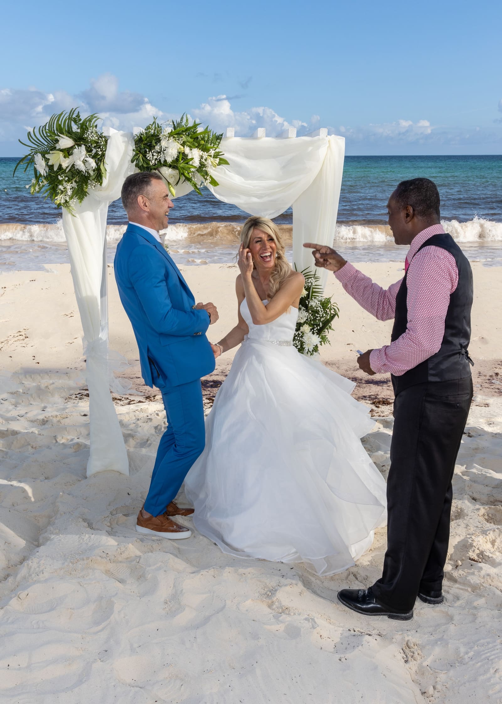 Couple laughing during their beach ceremony, Barbados