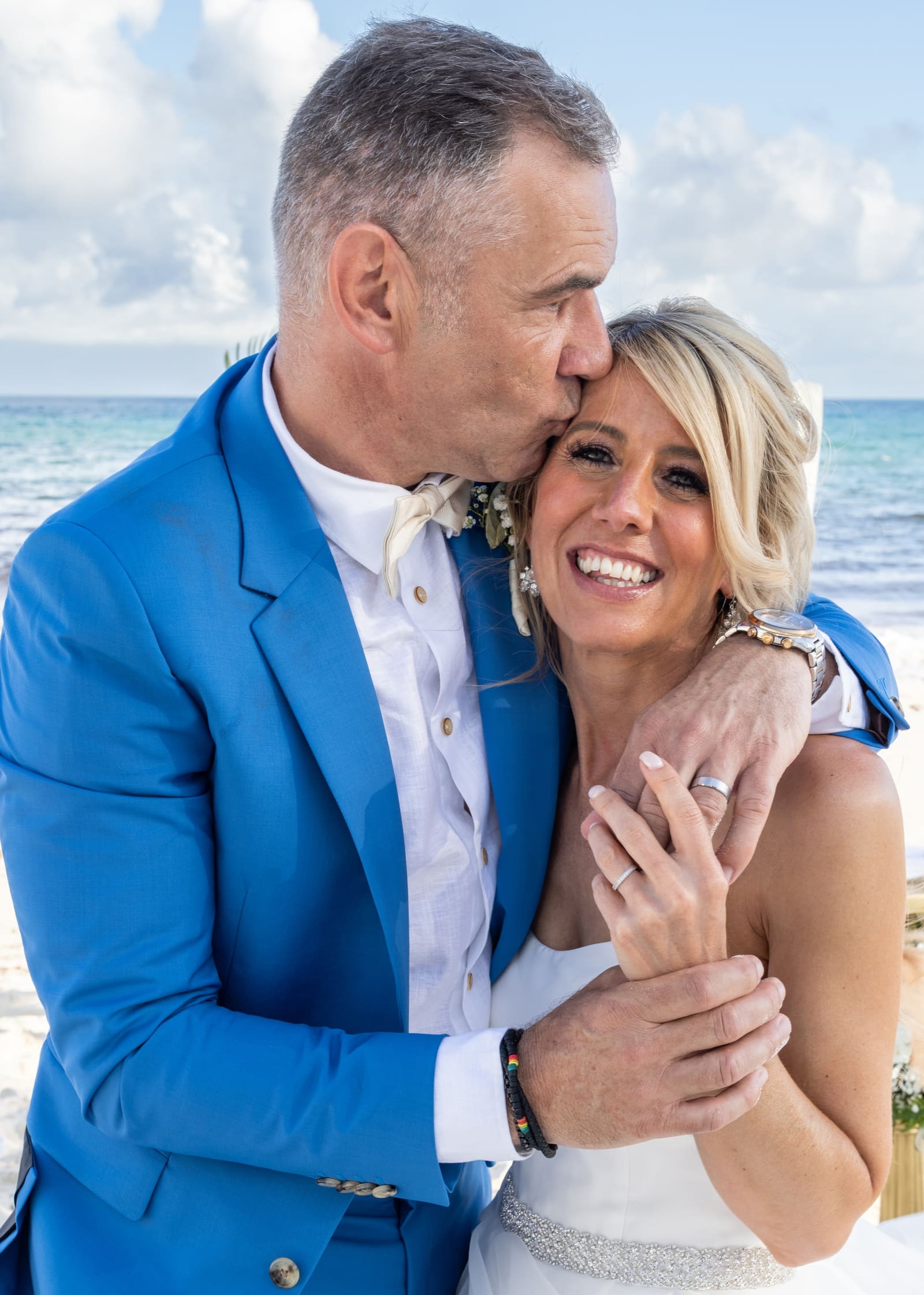 Groom kissing the bride’s cheek, Barbados