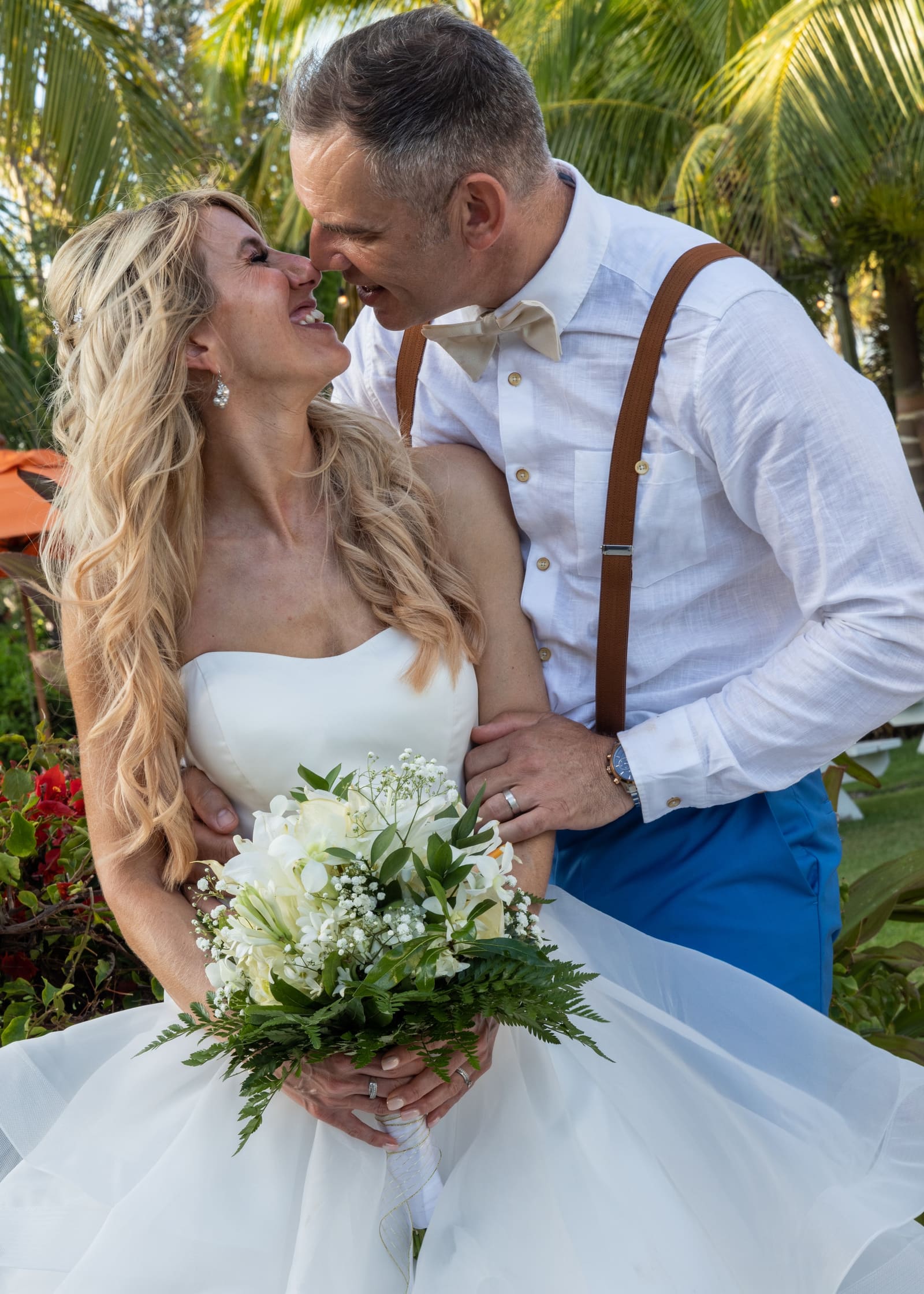 Couple kissing in a tropical garden, Barbados